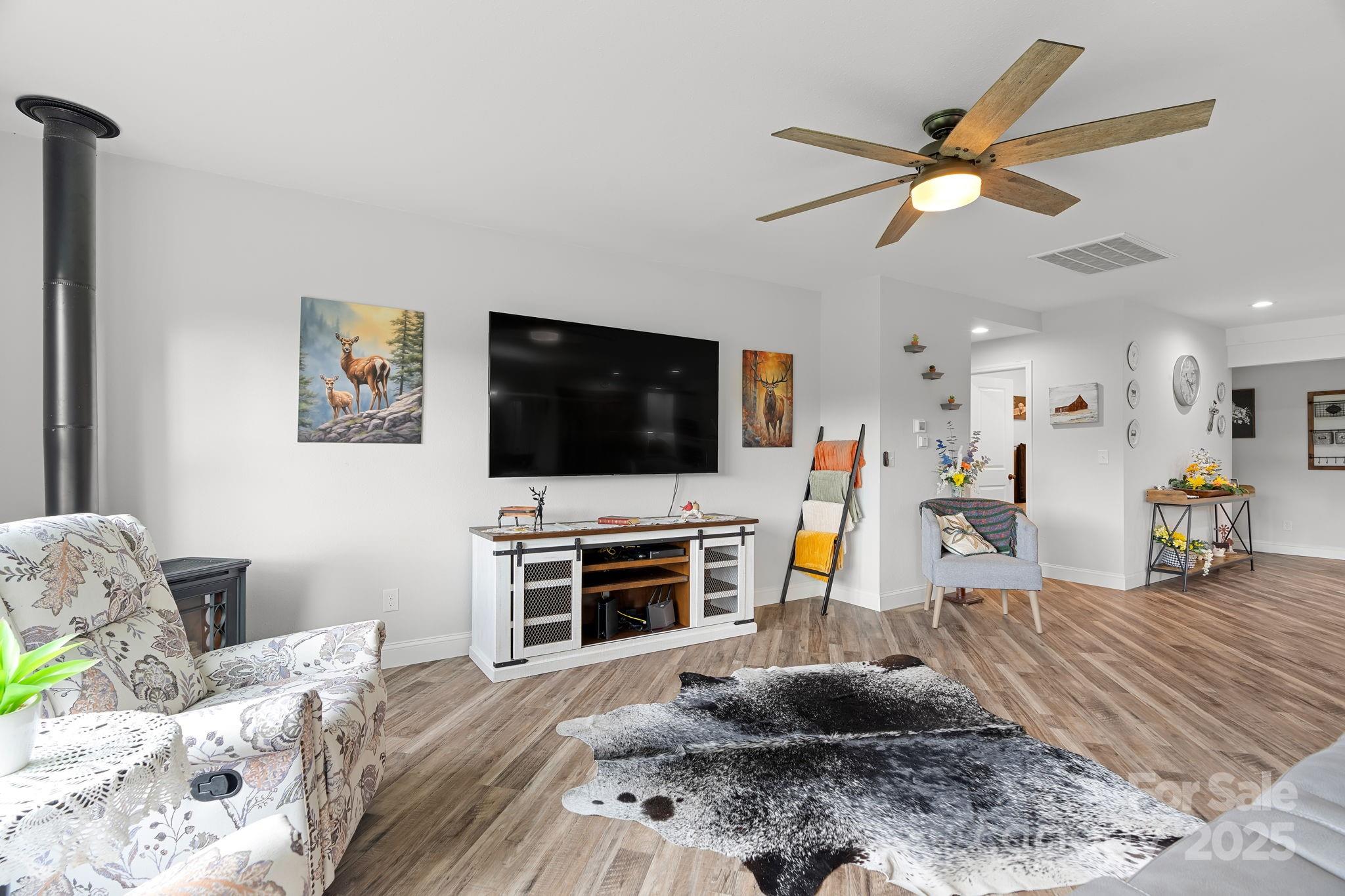 204 Mountain Spring Lane Canton, NC 28716 - Photo 8 of 45 a living room with furniture and a flat screen tv