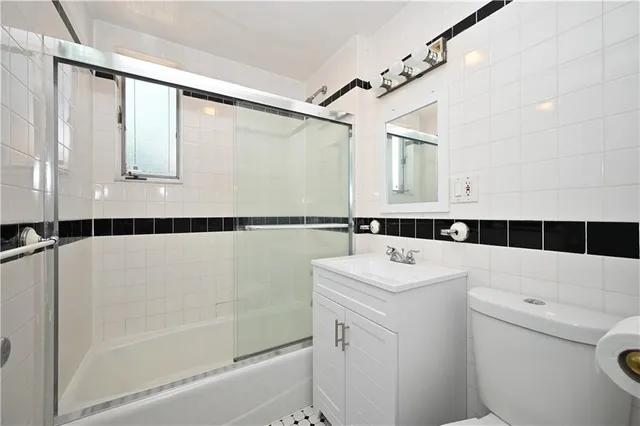 a bathroom with a sink a toilet and a bathtub