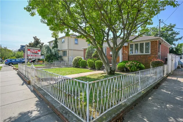 a view of a wrought iron fences in front of house