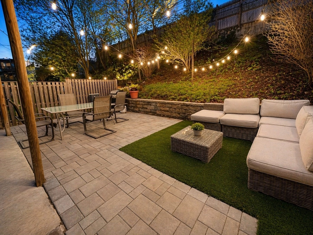 61 Wordsworth Street, Unit 2 Boston, MA 02128 - Photo 11 of 12 a view of a patio with couches and a fire pit
