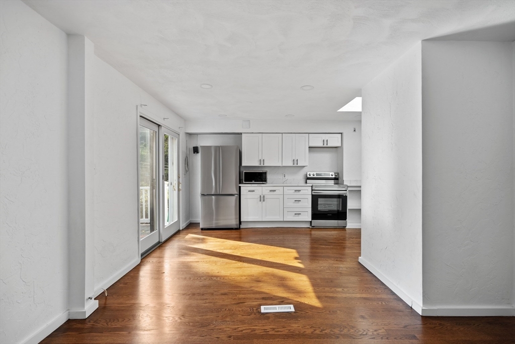 61 Wordsworth Street, Unit 2 Boston, MA 02128 - Photo 4 of 12 a view of kitchen with wooden floor
