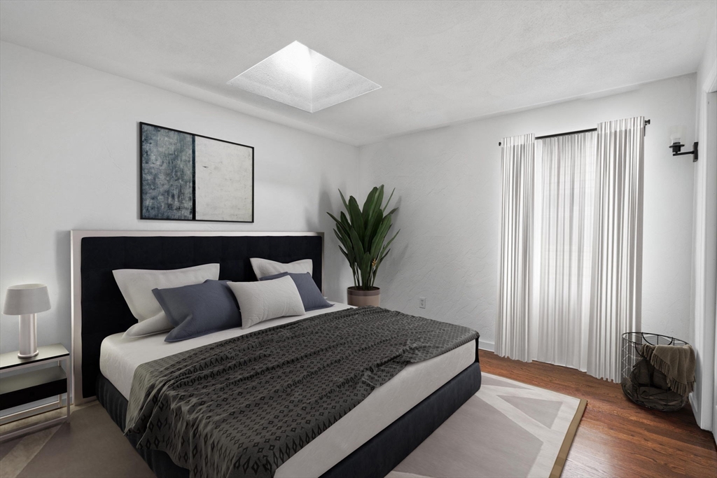 61 Wordsworth Street, Unit 2 Boston, MA 02128 - Photo 5 of 12 a bedroom with bed and window