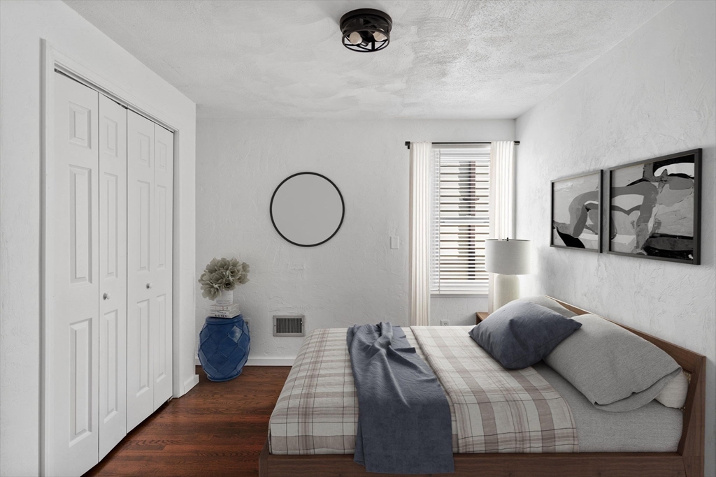 61 Wordsworth Street, Unit 2 Boston, MA 02128 - Photo 6 of 12 a bedroom with furniture and a window
