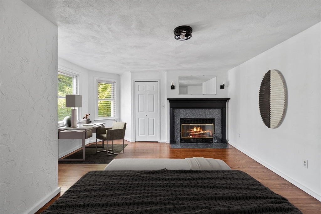 61 Wordsworth Street, Unit 2 Boston, MA 02128 - Photo 7 of 12 a living room with furniture and a fireplace