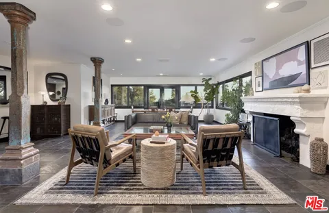 a living room with furniture and a table