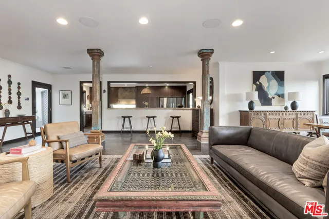 a living room with furniture and a table