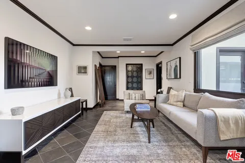 a bathroom with a granite countertop sink a mirror and shower