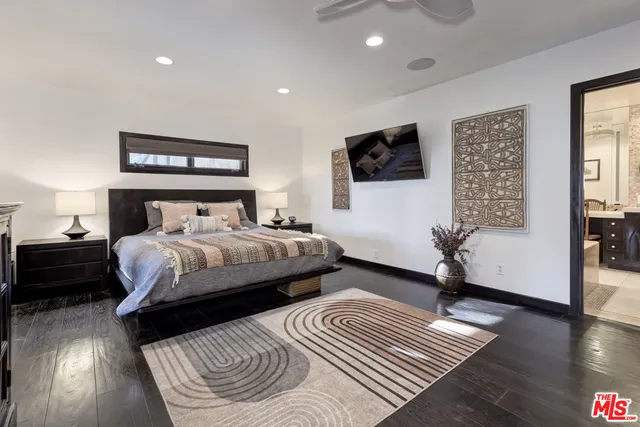 a bedroom with double bed and a window