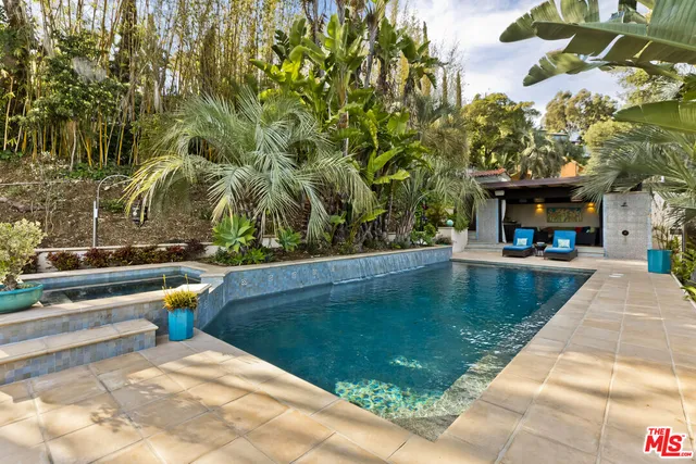 a view of swimming pool with chairs