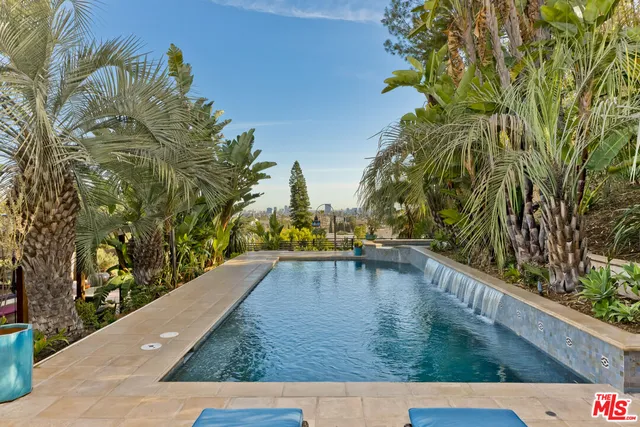 a view of a backyard with chairs