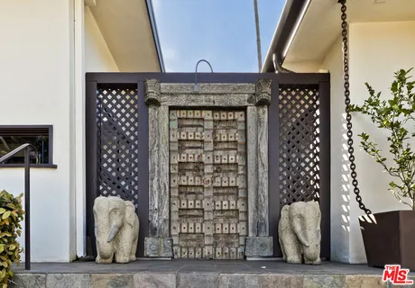 a view of an entryway door and deck in the room