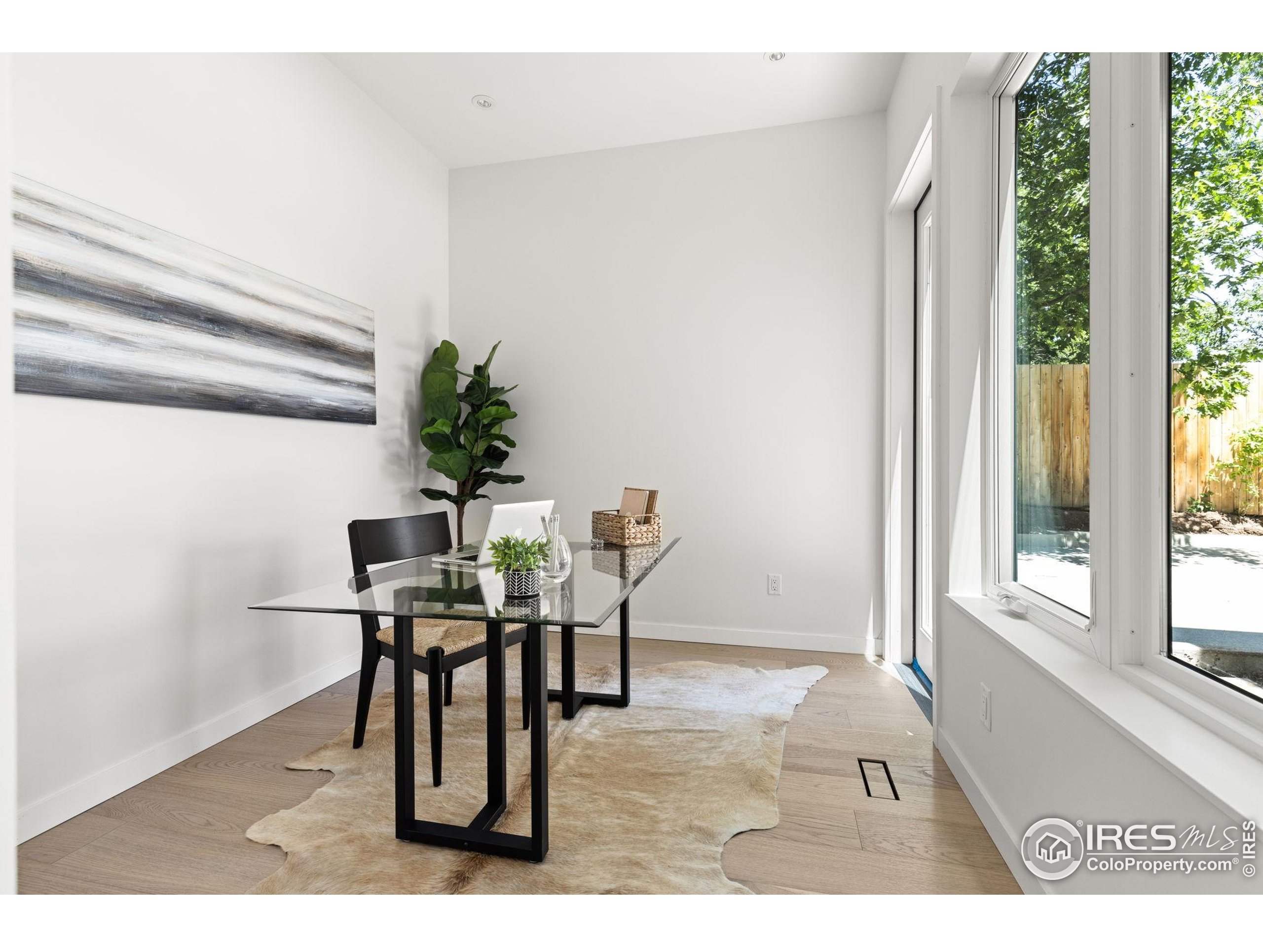 3315 Broadway Boulder, CO 80304 - Photo 14 of 42 a view of a dining room with furniture and a window