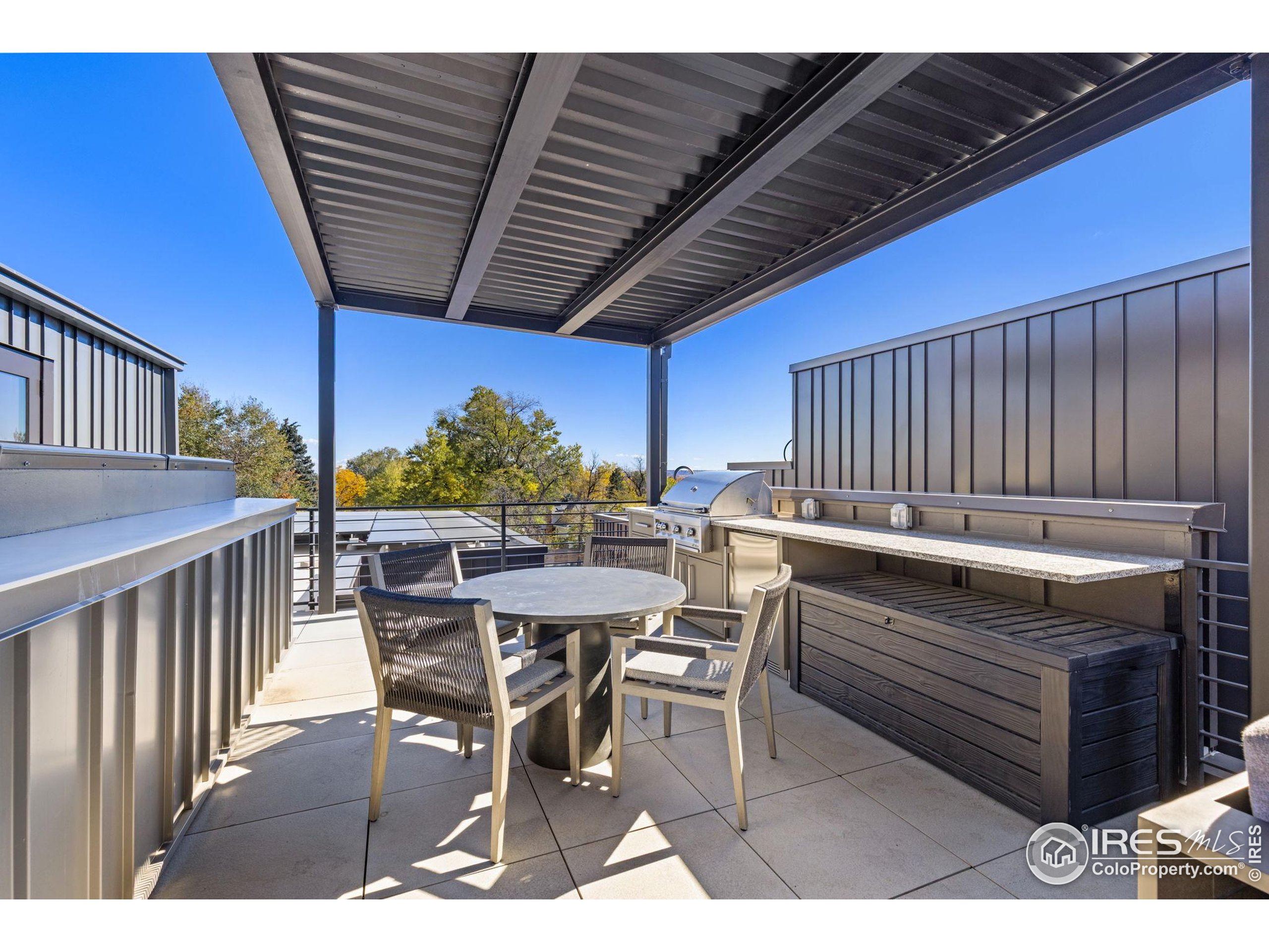 3315 Broadway Boulder, CO 80304 - Photo 42 of 42 a view of a patio with table and chairs with wooden floor