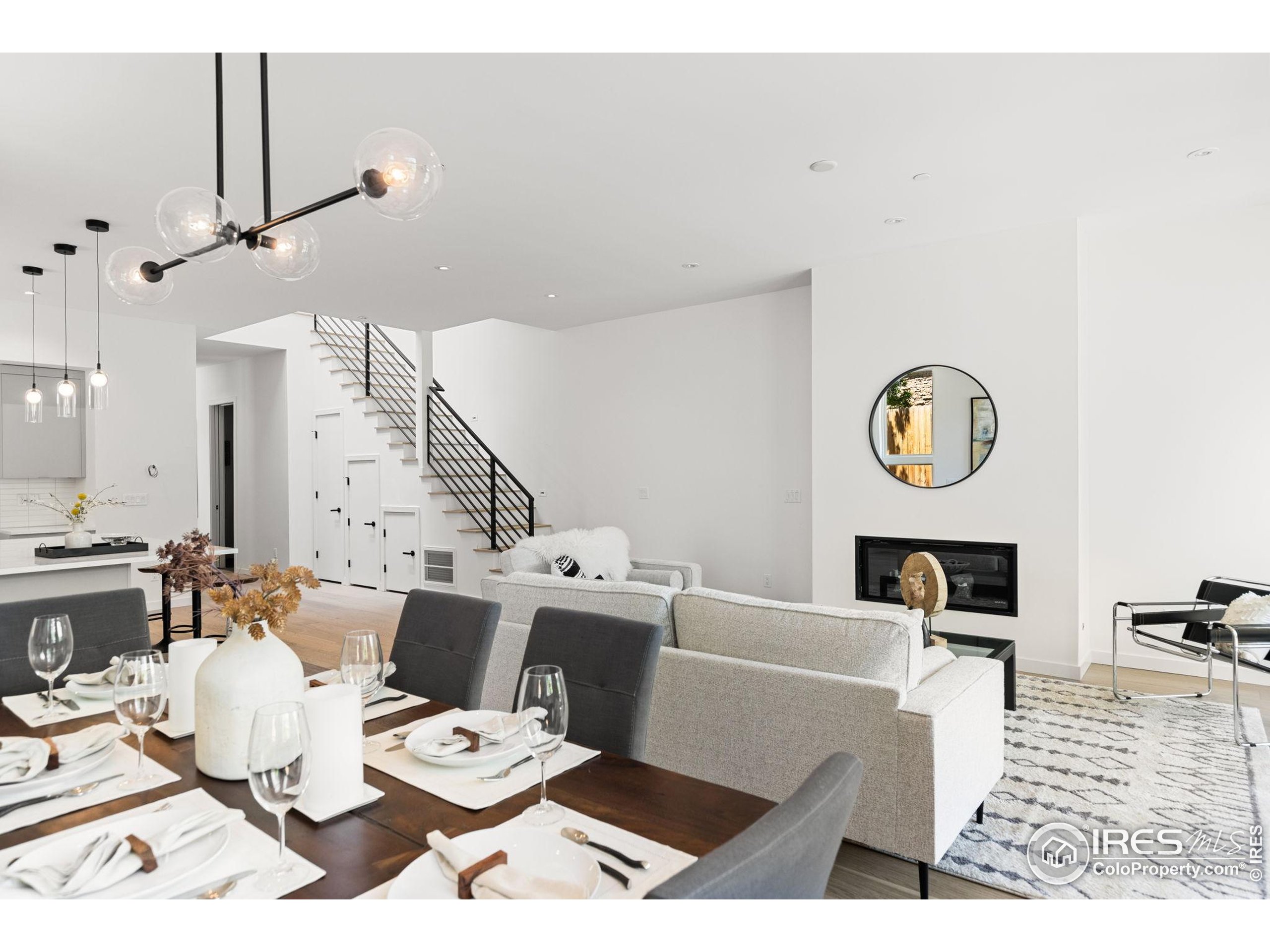 3315 Broadway Boulder, CO 80304 - Photo 6 of 42 a living room with lots of furniture and a clock