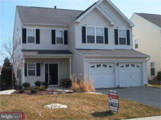a front view of a house with a garage