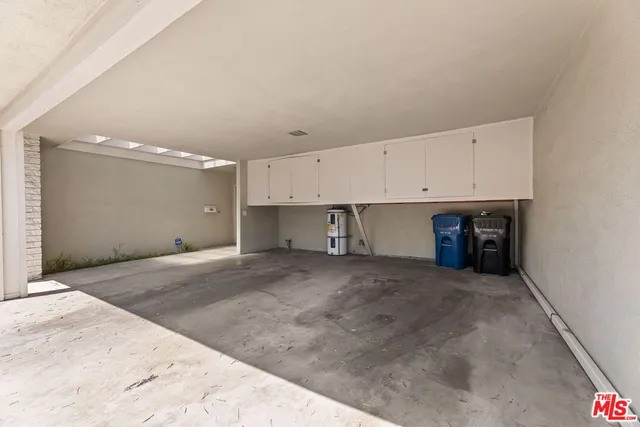 a view of a kitchen with a sink and cabinets