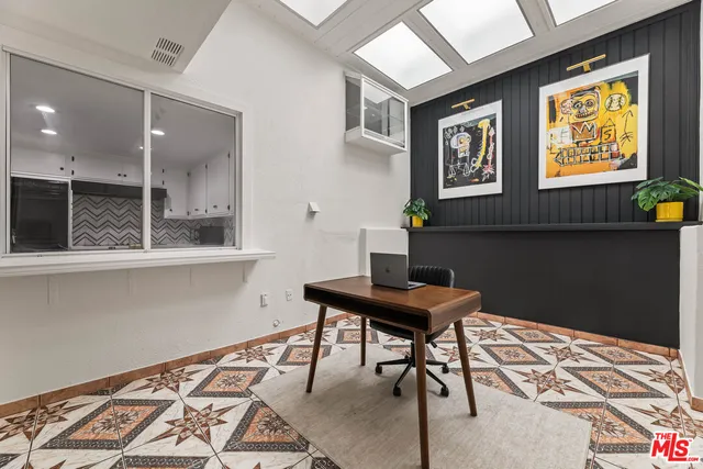 a workspace with furniture and window