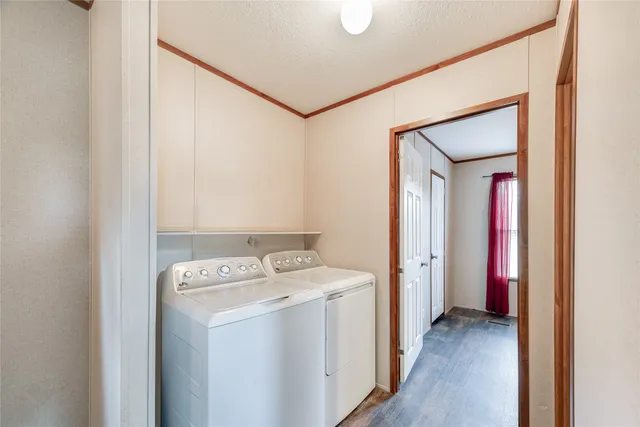 a view of a storage & utility room with a washer dryer