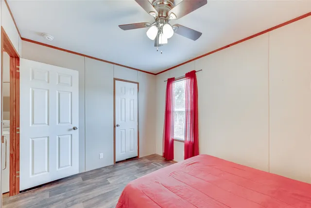 a bed room with a bed and a chandelier