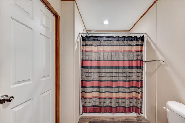 a bathroom with a shower and a sink