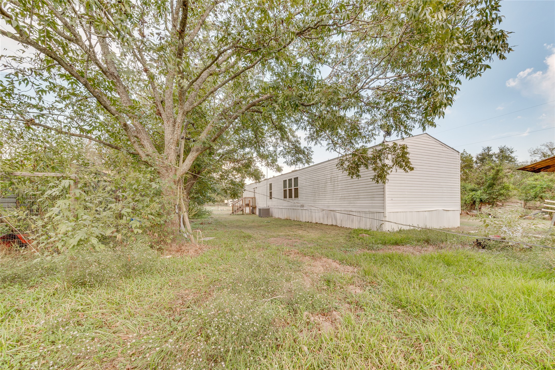 232 North Kerr Road Wharton, TX 77488 - Photo 33 of 37 a view of a backyard with large trees
