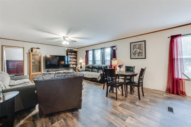 a view of a dining room with furniture window and wooden floor