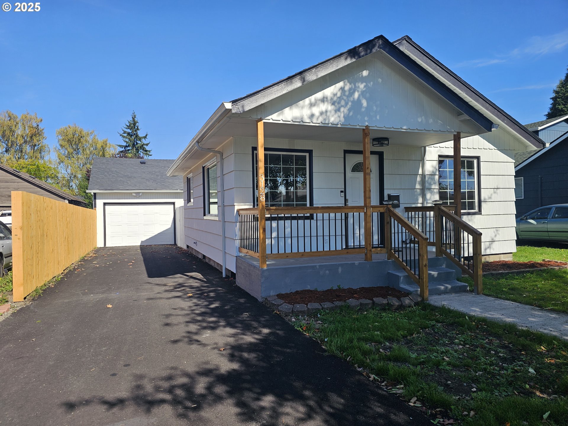 a view of a house with a yard and deck