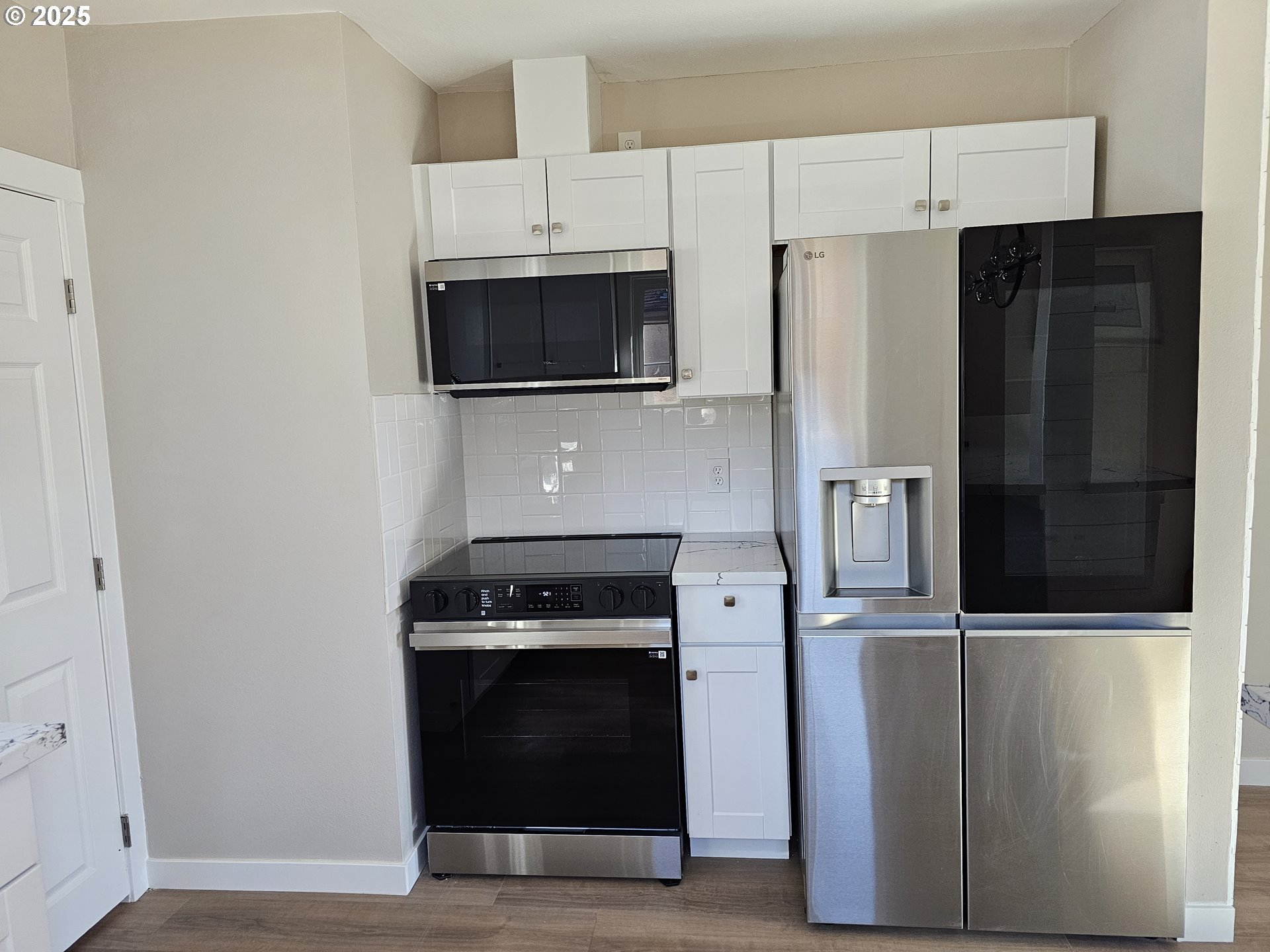 3128 Garfield Street Longview, WA 98632 - Photo 24 of 48 a kitchen with stainless steel appliances and refrigerator