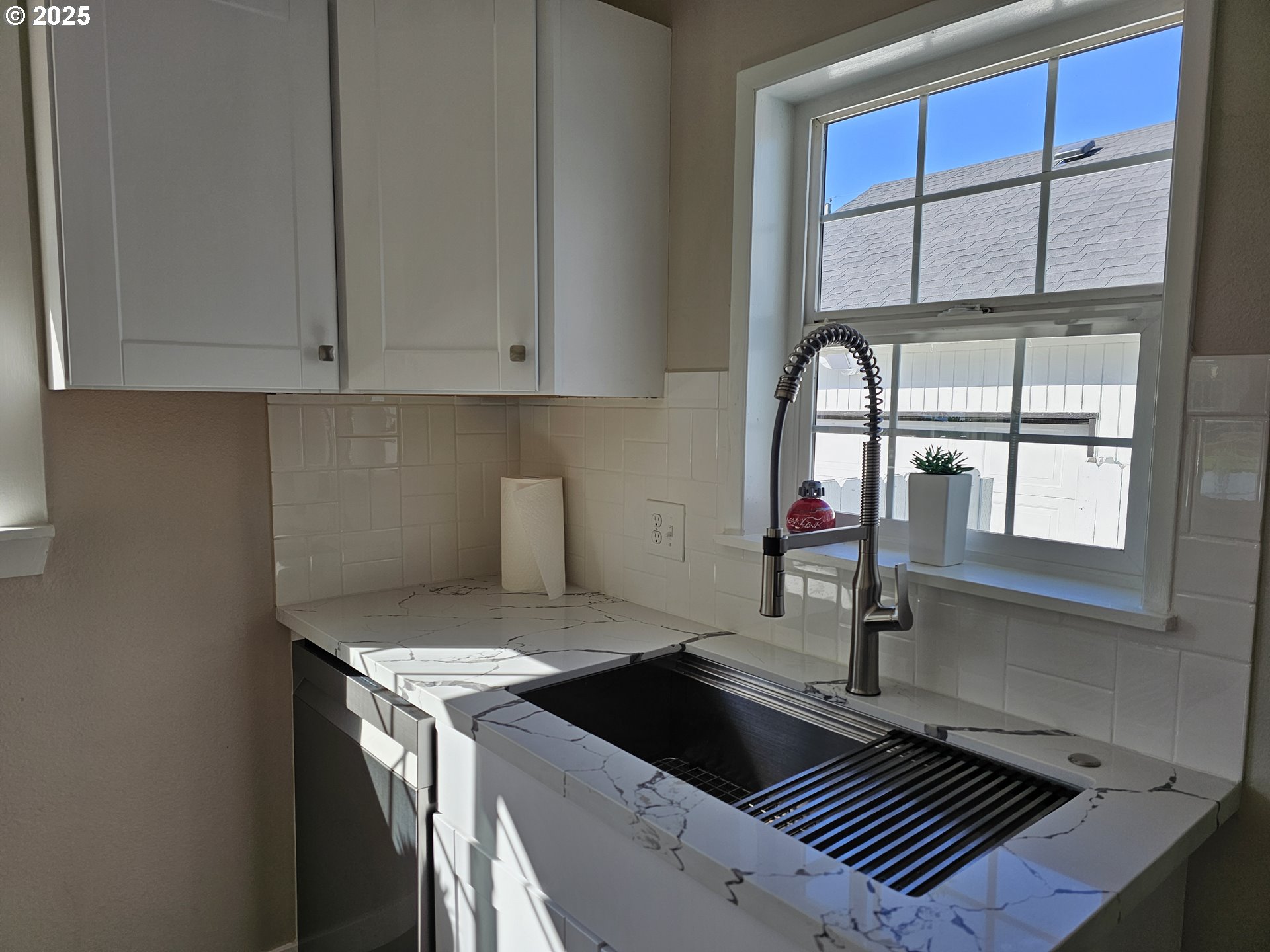 3128 Garfield Street Longview, WA 98632 - Photo 25 of 48 a kitchen with a sink and cabinets