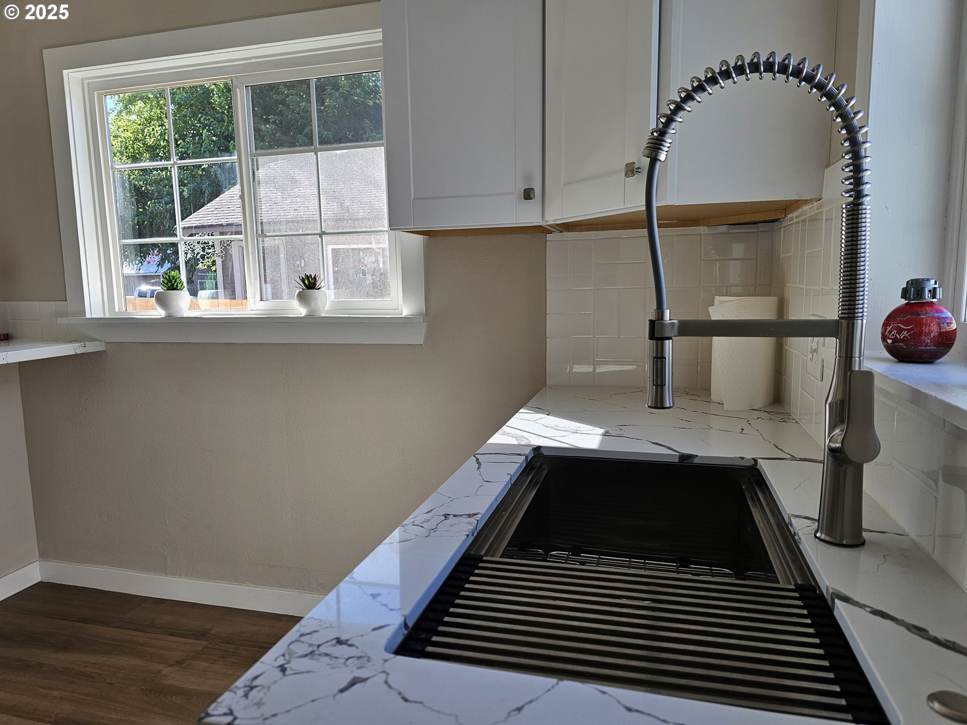 3128 Garfield Street Longview, WA 98632 - Photo 26 of 48 a kitchen with a sink and cabinets