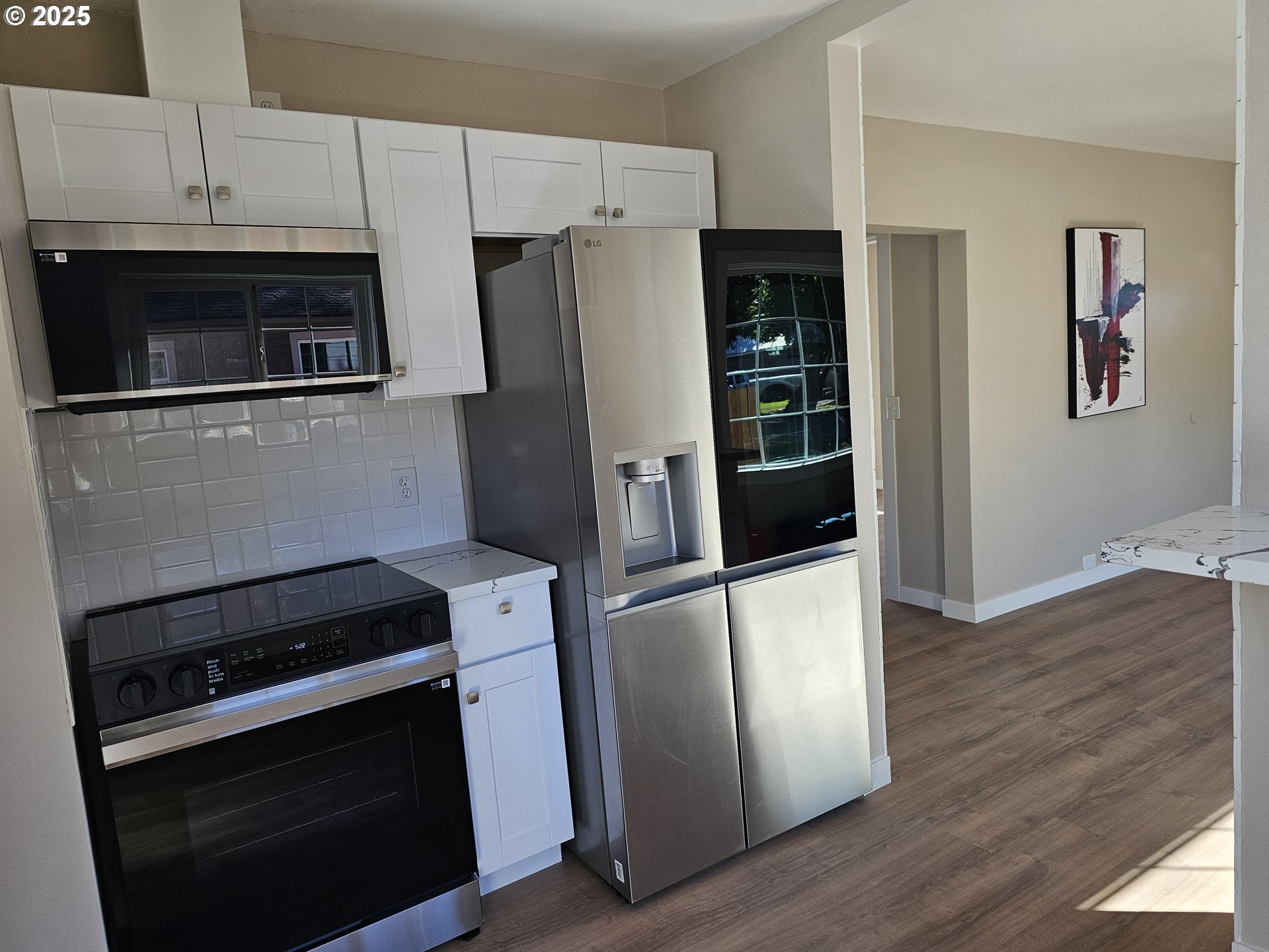 3128 Garfield Street Longview, WA 98632 - Photo 27 of 48 a kitchen with a refrigerator stove and cabinets