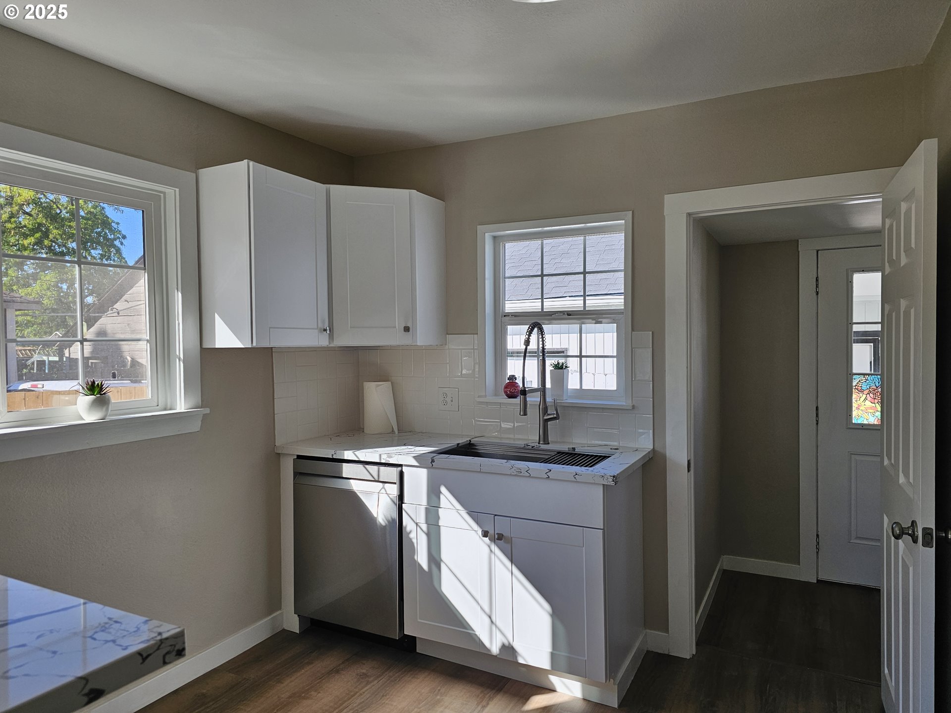 3128 Garfield Street Longview, WA 98632 - Photo 28 of 48 a kitchen with stainless steel appliances granite countertop a sink a stove and a window