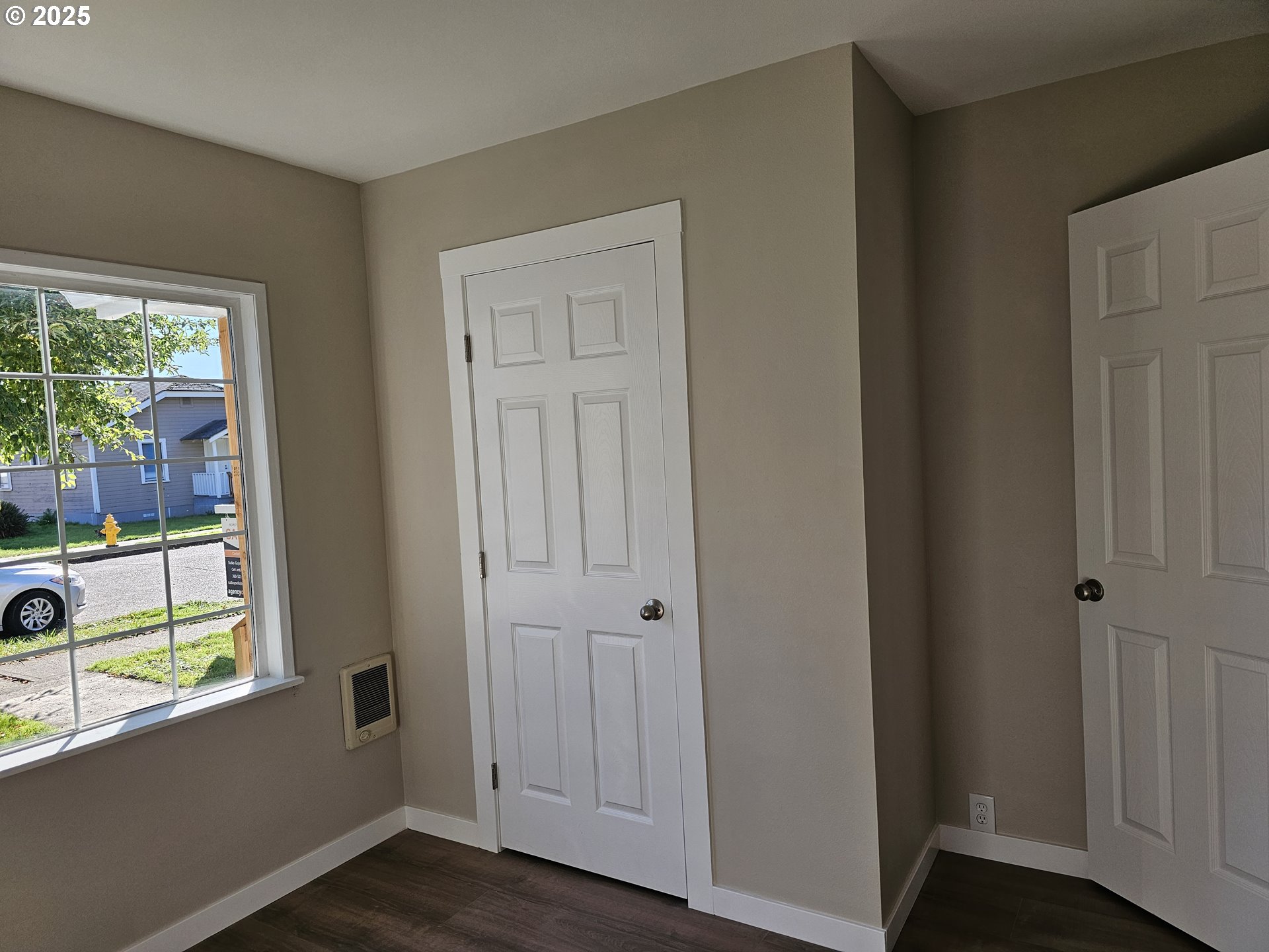 3128 Garfield Street Longview, WA 98632 - Photo 34 of 48 an empty room with wooden floor and windows