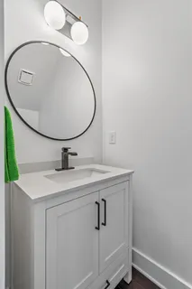 a bathroom with a sink and mirror
