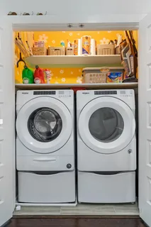 a utility room with washer and dryer