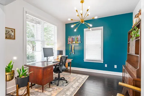 a workspace with furniture and a window