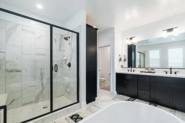 a bathroom with a bathtub and a sink