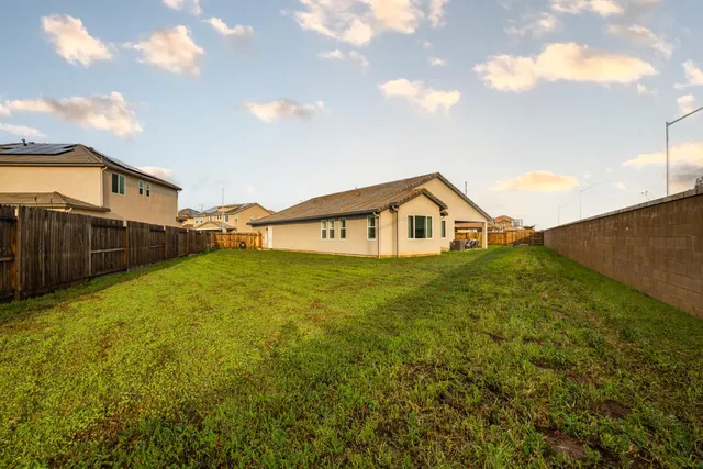 a front view of house with yard and seating area