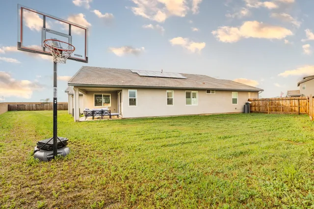 an aerial view of a house with a swimming pool