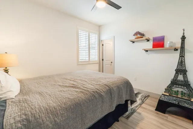 a bedroom with a bed and a dresser