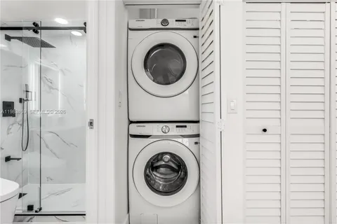 a bathroom with a toilet sink and shower