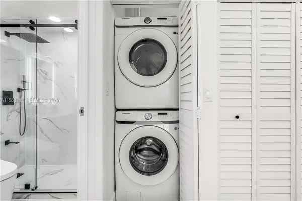 a bathroom with a toilet sink and shower