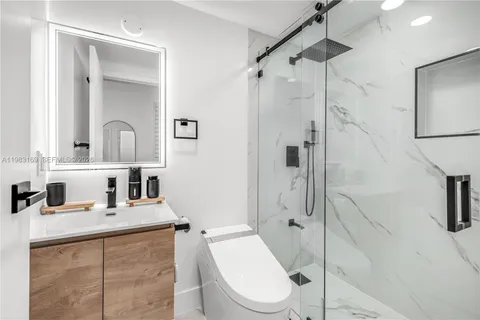 a bedroom with bed and window