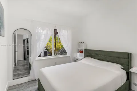 a bedroom with a bed and a cabinets