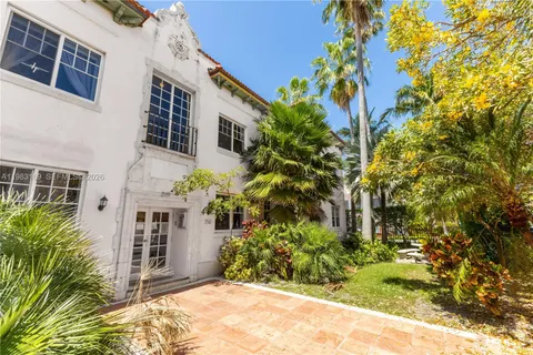 a outdoor space with a table and chairs