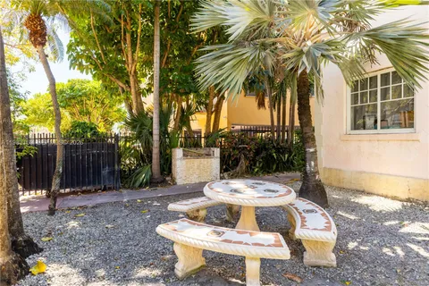 a view of a palm trees in front of a house