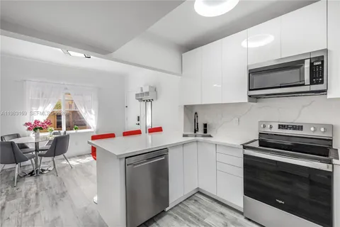 a kitchen with a stove and a microwave