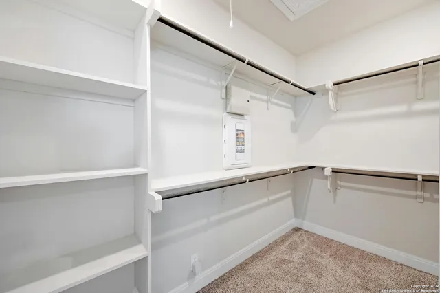 a view of an empty walk in closet