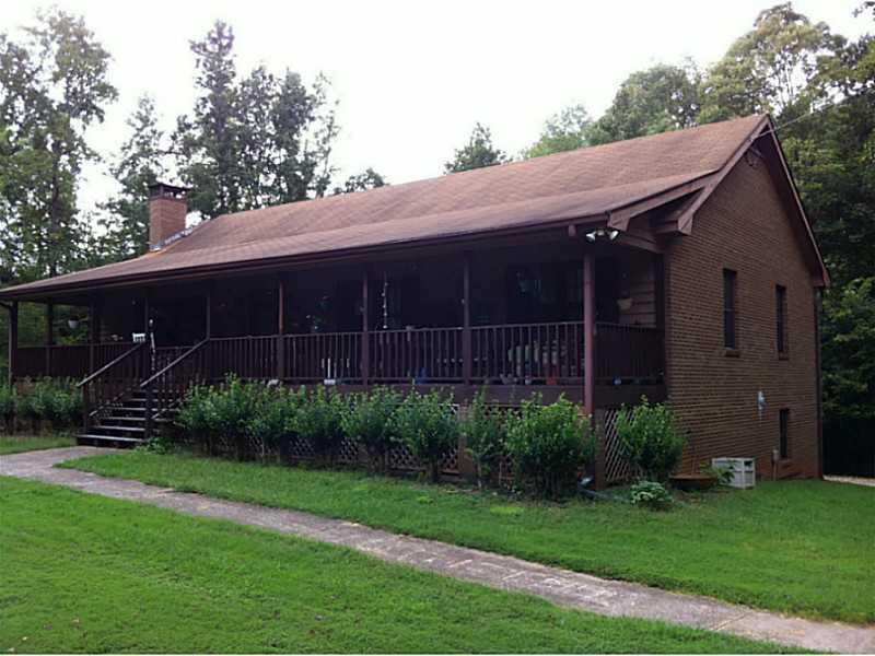 Exterior Front. Huge rocking chair front porch on 2.99 acres!  Partial unfinished basement!
