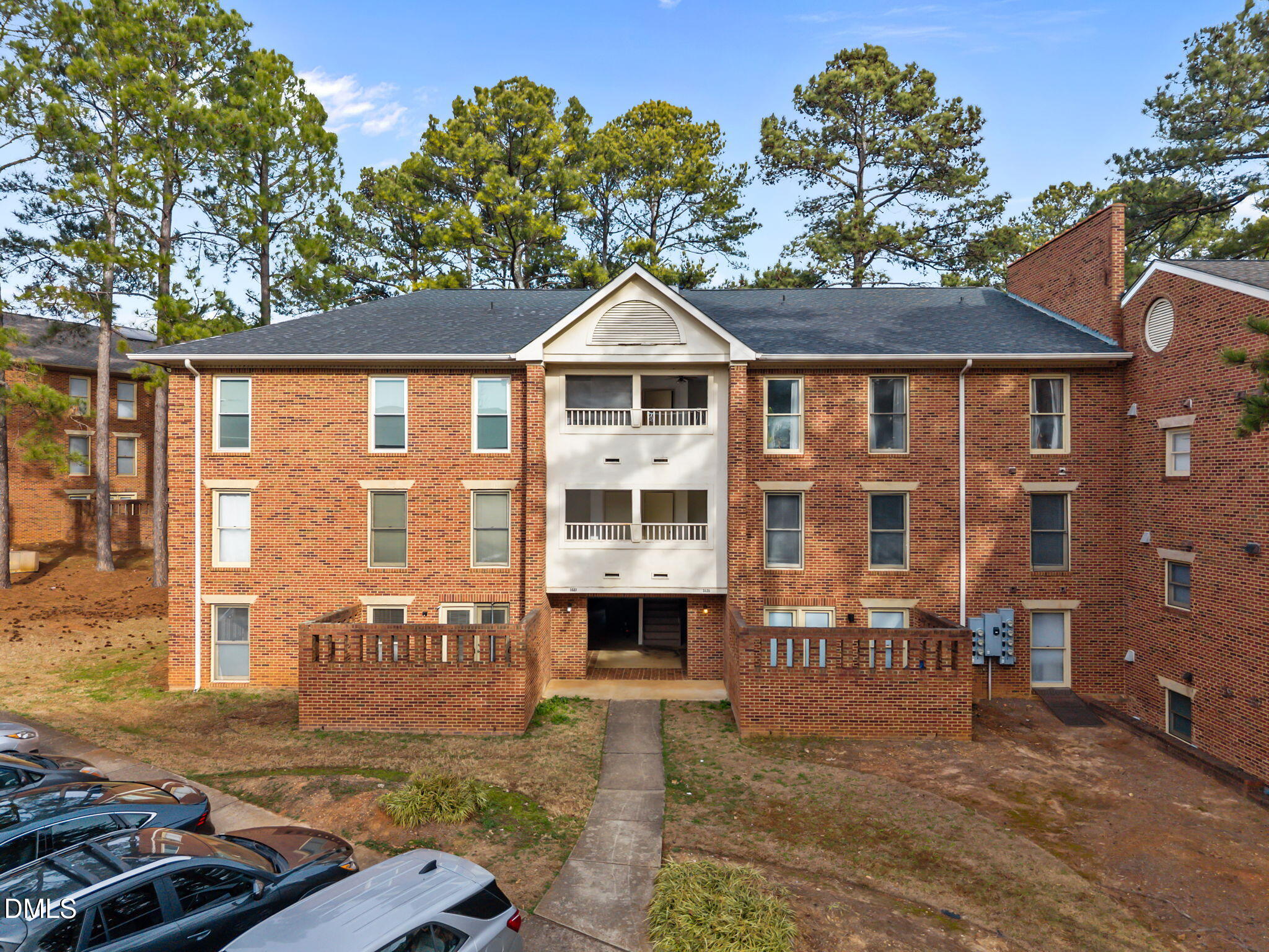 3527 Ivy Commons Drive, Unit 102 Raleigh, NC 27606 - Photo 3 of 33 6-web-or-mls-DJI_20260102102021_0846_D